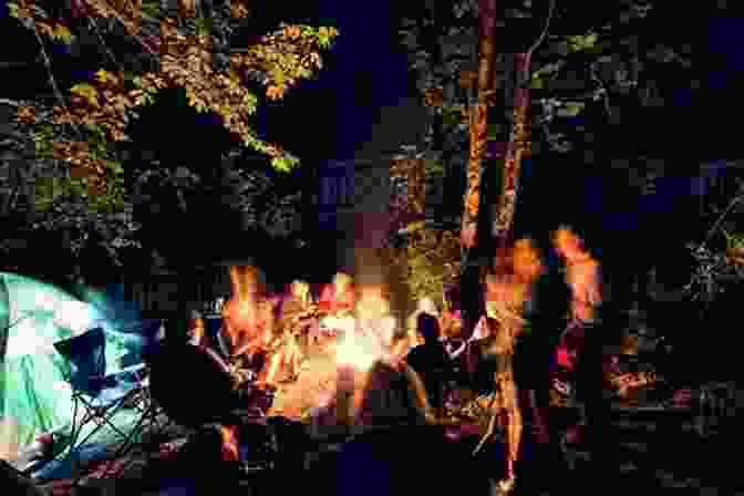 A Group Of People Gathered Around A Campfire In A Dark, Eerie Forest Ghostland: An American History In Haunted Places