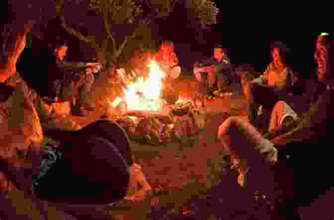 A Group Of People Gathered Around A Campfire, Listening Intently To A Storyteller Who Weaves Tales Of Legendary Heroes, Their Eyes Filled With Wonder And Aspiration. The Creators: A History Of Heroes Of The Imagination (Knowledge 1)